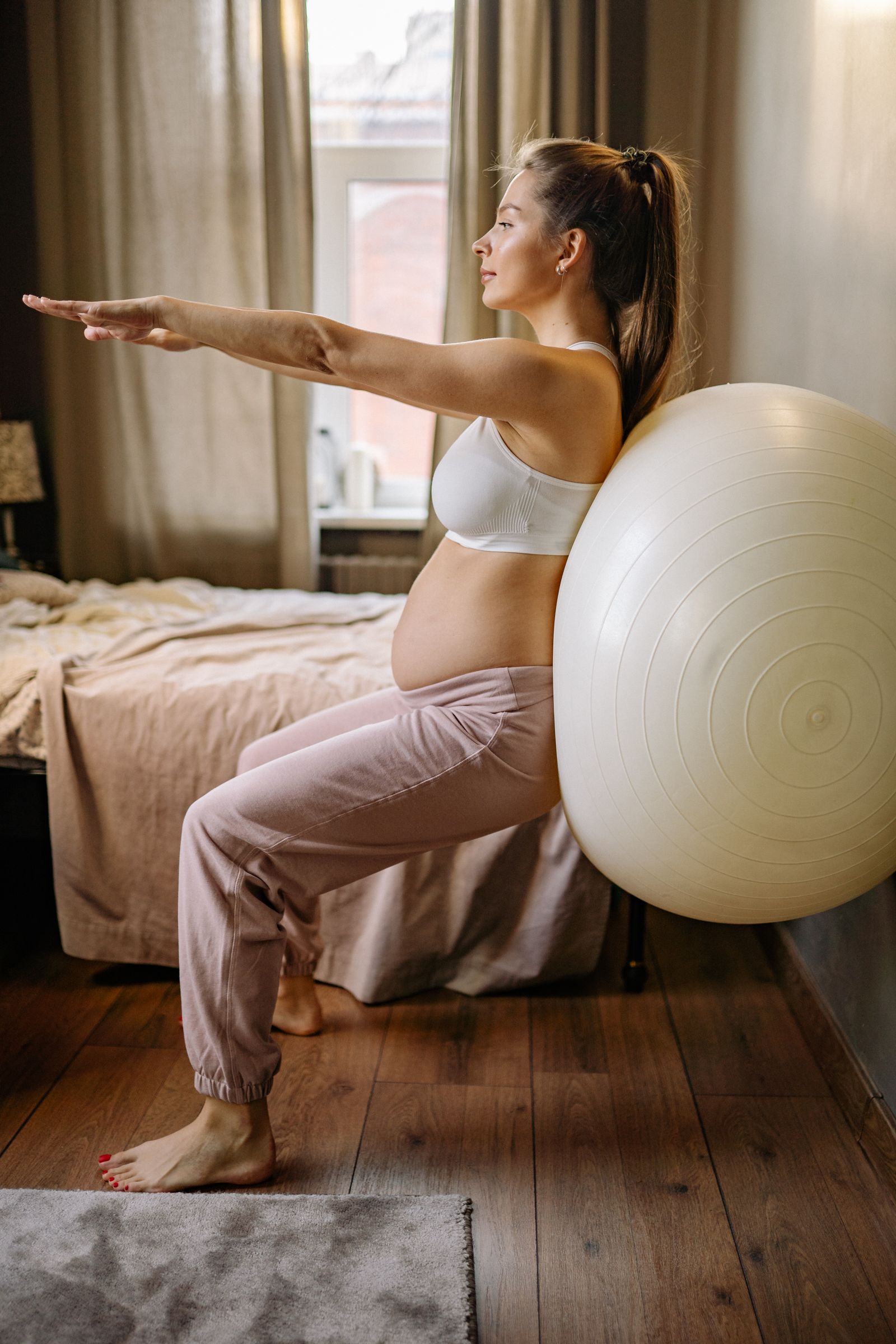 A specialist supporting a mother through movement and recovery